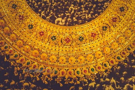 Photo of traditional gold bridal jewellery with precious gem stones