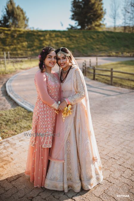 Photo of Pastel bride with sister