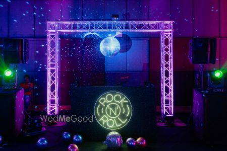 Photo of Disco themed sangeet and cocktail night decor with rock and roll lighting ideas