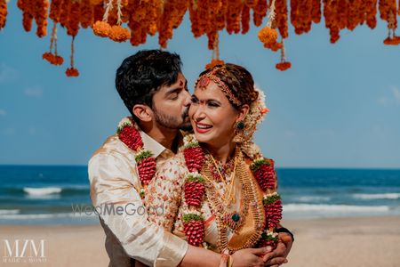 Photo of bright and happy south indian couple shot