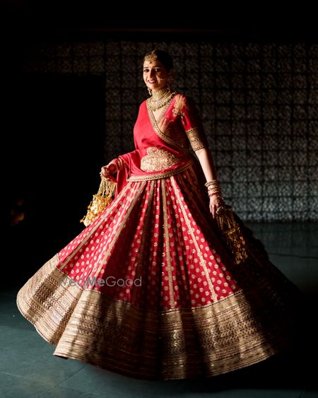 Photo of bride in red lehenga