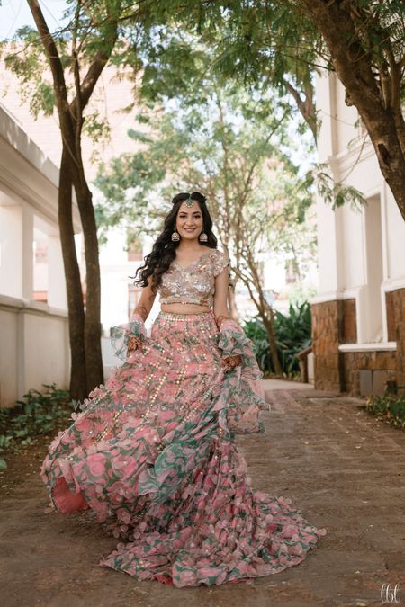 Photo of pink and green lehenga on mehendi with ruffled dupatta