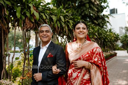 Photo of Bride entering her wedding with her father