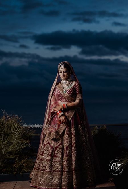 Photo of classic maroon heavy bridal lehenga