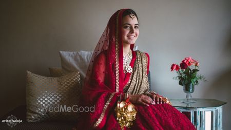 Photo of red and gold bridal lehenga