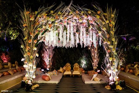 Photo of A mandap decorated with flowers and pampas grass.