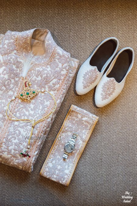 Photo of groom getting ready shot with sherwani and shoes