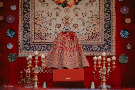 Photo of Red bridal lehenga on hanger