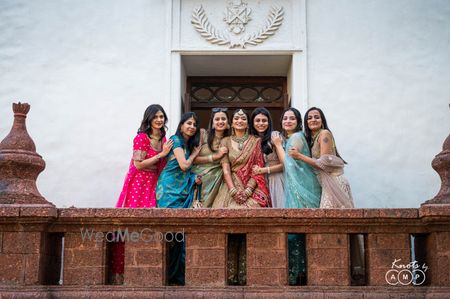 Photo of beautiful bride with her bridesmaids