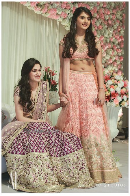 Photo of Bride and bridesmaid in purple and pink