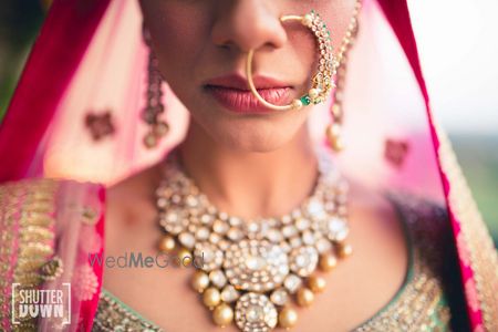 Photo of Green bridal Nath and bib necklace