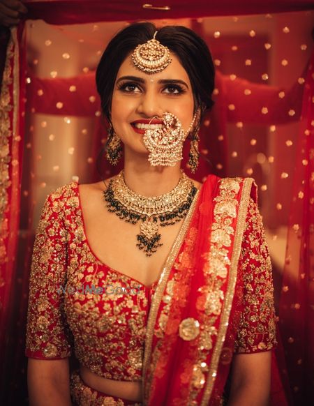 Photo of Bride getting ready dupatta placing on head shot