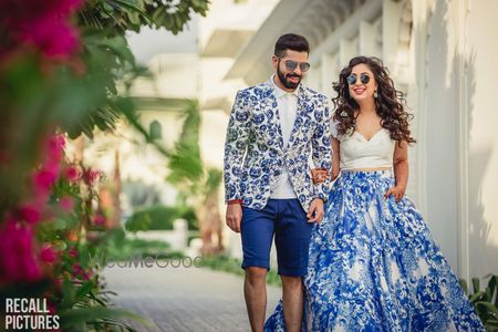 Photo of Bride and groom in pool party twinning outfits