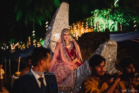 Photo of Unique grand bridal entry with moon prop