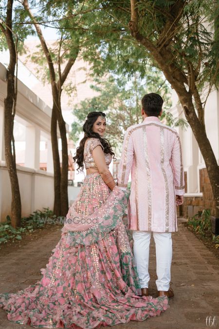 Photo of light pink mehendi lehenga with train and trail