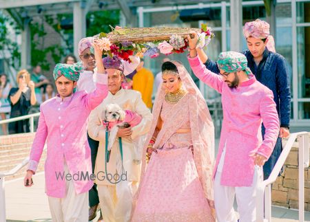 Photo of Bride entering under dried floral phoolon ki chadar