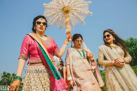 Photo of Bridal entry with a floral umbrella