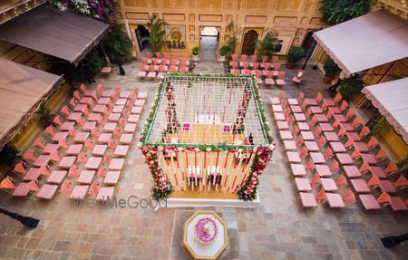 Photo of mandap seating ideas with pink chairs around for seating