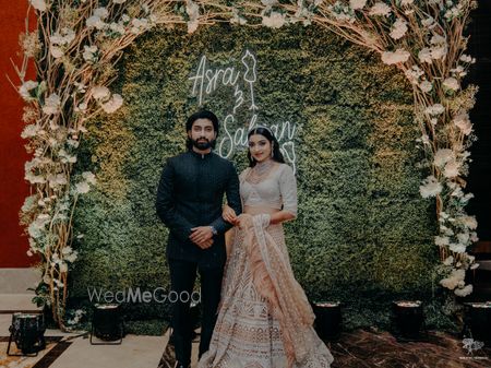 Photo of personalised photobooth decor with the couples names on it