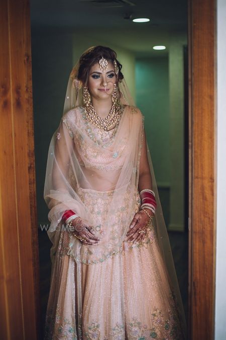 Photo of Pastel bridal lehenga in peach