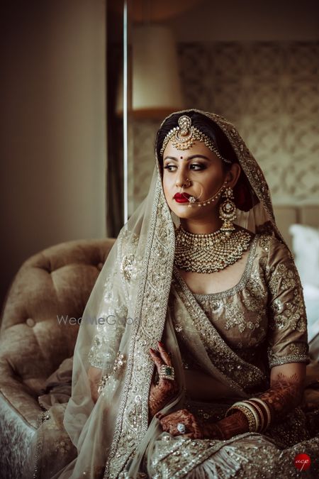 Photo of Bride in offbeat grey bridal lehengas