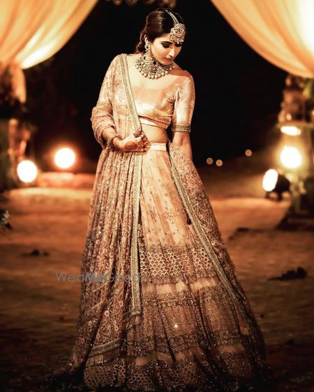 Photo of engagement day gold lehenga