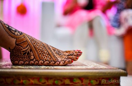 Photo of Bride feet mehendi shot