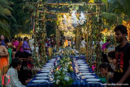 Photo of Outdoor table settings with hanging trellis