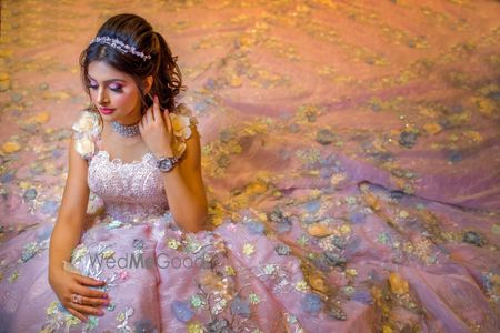 Photo of A bride in a glittering lavender gown with sequins.