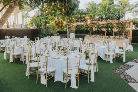 Photo of White table and chair setting decor.