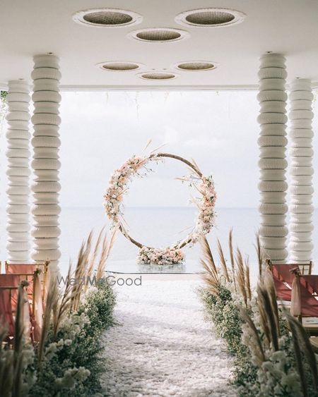 Photo of A rustic floral wreath decor for the vows.