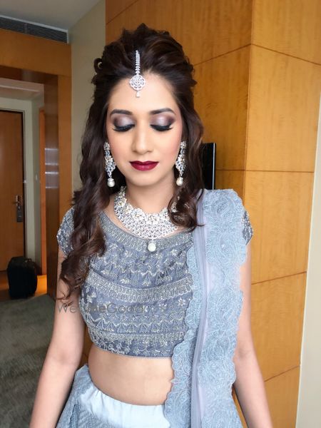 Photo of Pretty bride in silver lehenga with diamond jewellery