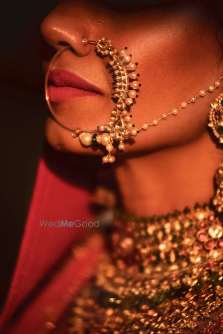 Photo of Big bridal nosering with pearls and a chain