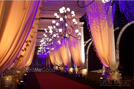 Photo of Gold and Purple Drapes with Chandeliers Entrance Decor