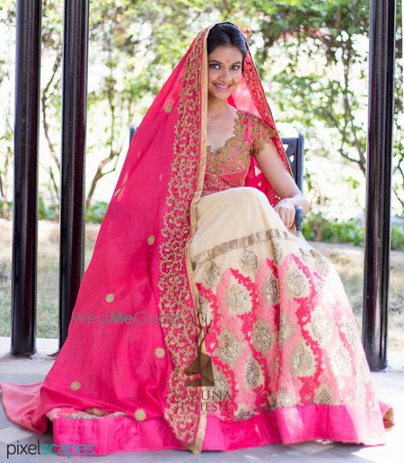 Photo of cream an bright pink lehenga