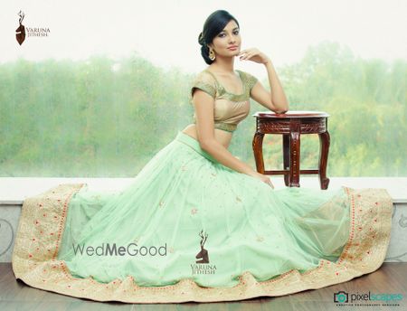 Photo of mint georgette lehenga with border and gold metallic short sleeved blouse