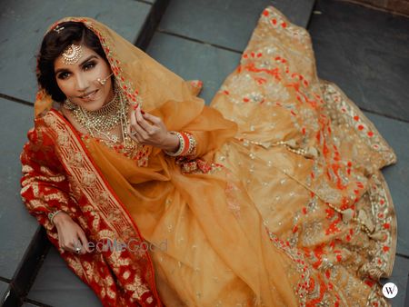 Photo of A bride in a yellow outfit with a contrasting dupatta