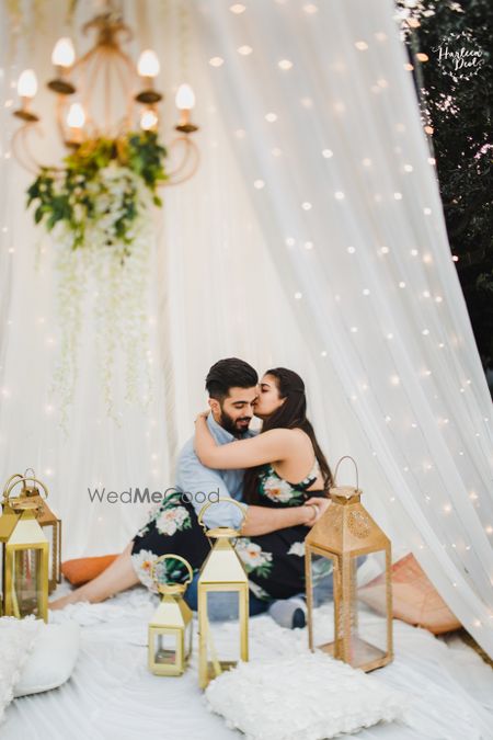 Photo of Couple kissing glamping pre wedding shoot idea