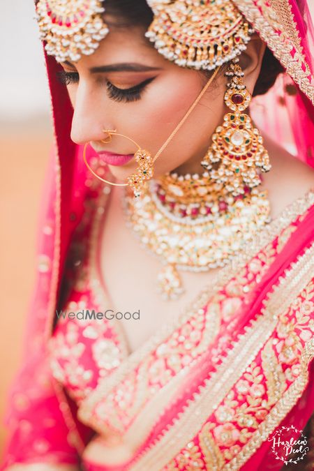 Photo of Matching red polki and jadau jewellery with red lehenga