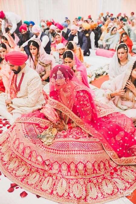 Photo of Red Sabyasachi bridal lehenga flared out