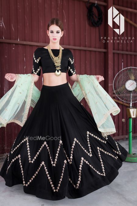 Photo of Black and gold lehenga with mint dupatta