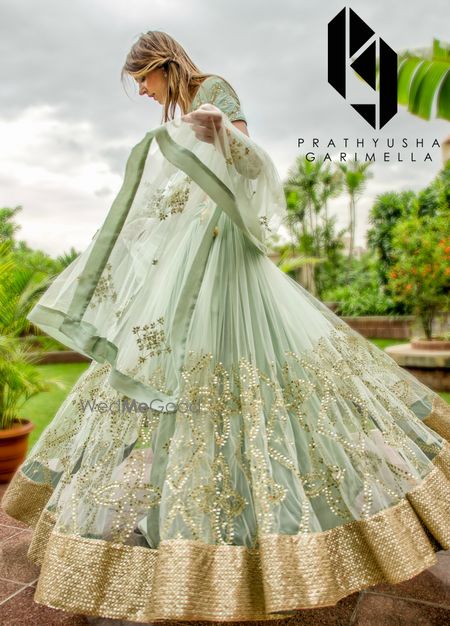 Photo of Mint and gold girly engagement lehenga