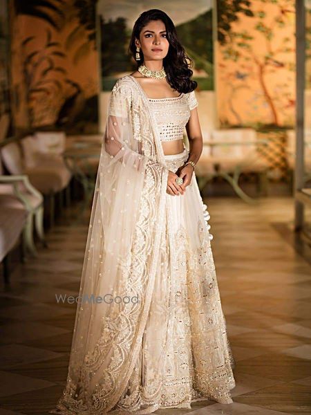 Photo of Ivory lehenga with chikankari and mirror work.