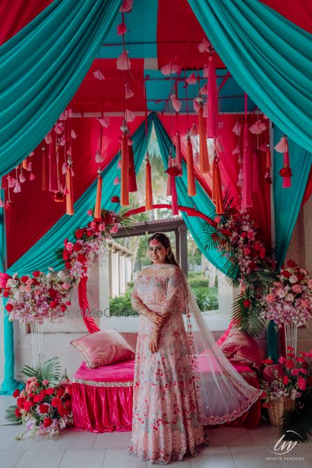 Photo of bride and bridal seat decor for mehendi