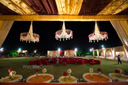 Photo of Marsala and Gold Tent with Floral Chandeliers