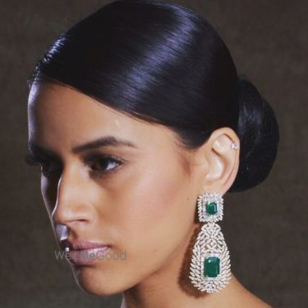 Photo of large diamond and emerald drop earrings