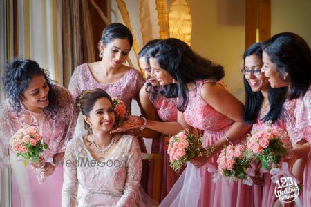 Photo of A Christian bride poses with her bridesmaids.