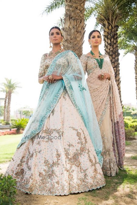 Photo of Cream and blue engagement lehenga