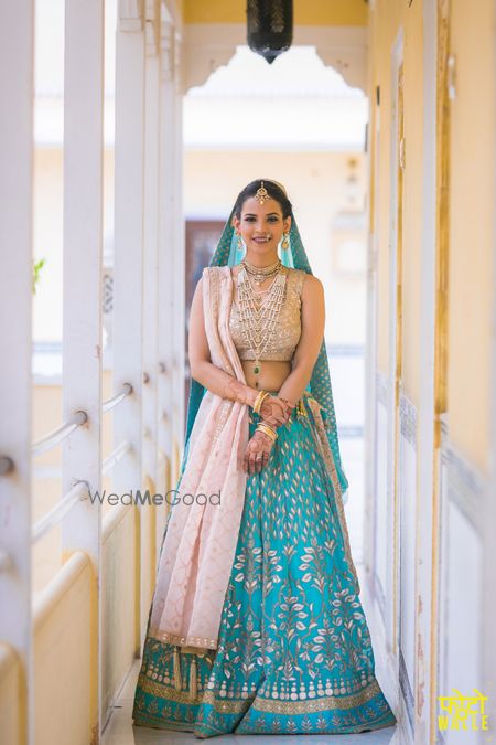 Photo of Turquoise and off white bridal lehenga