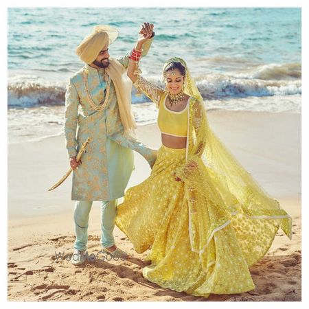 Photo of Pastel bride and groom outfits mint and yellow